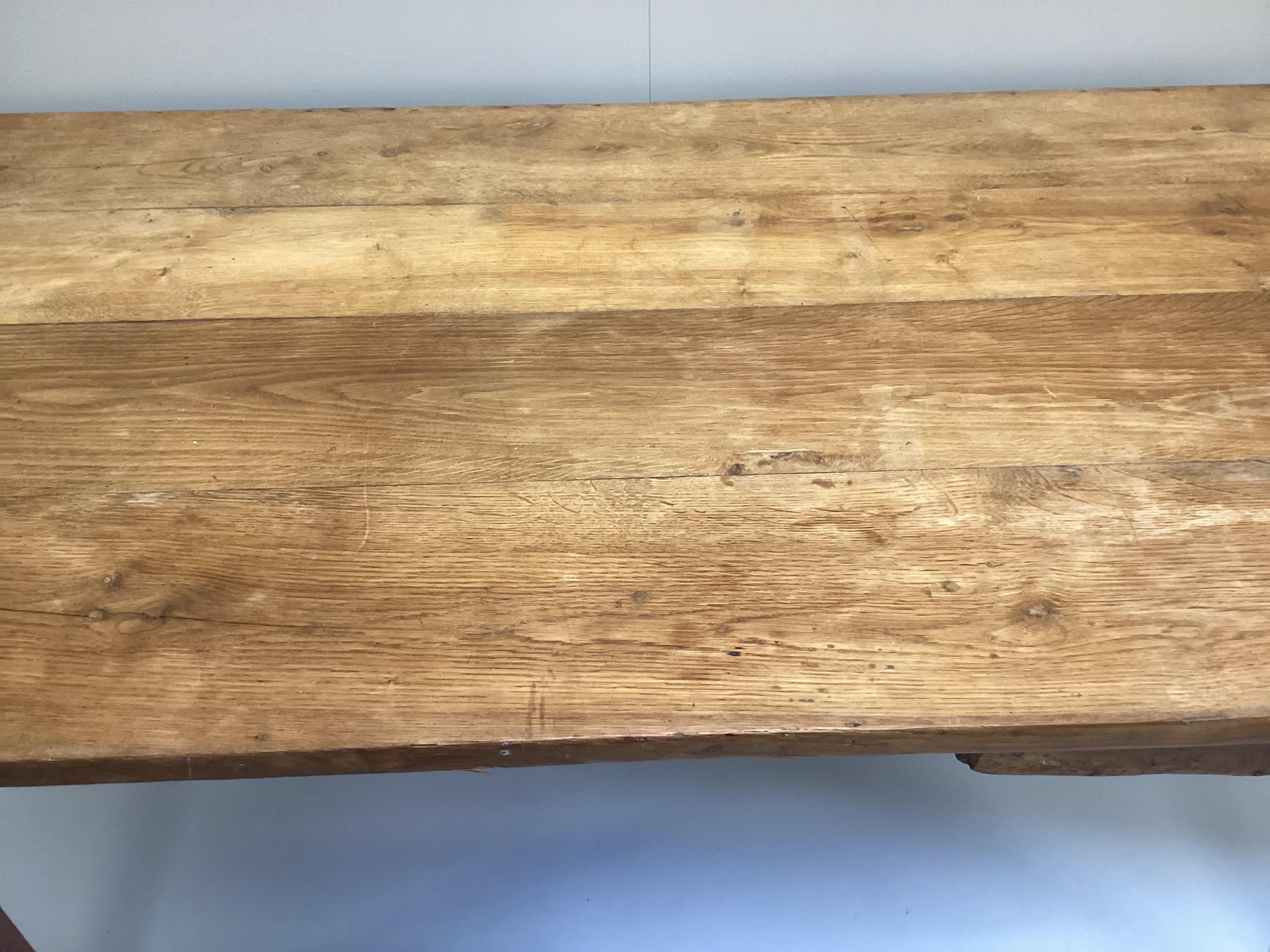 A 19th century French rectangular oak kitchen table, width 150cm, depth 82cm, height 77cm